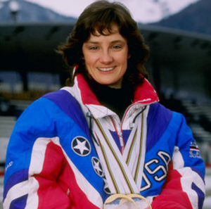 Image description: A photo of Bonnie Blair wearing her Olympic gold medals.
