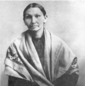 Image description: A black-and-white portrait-style photo of Electa Quinney.